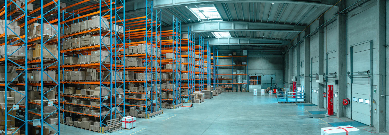 Tall racking stacked with cartons in a distribution warehouse